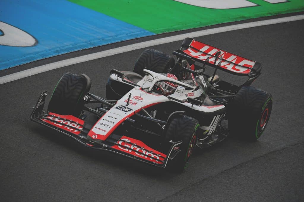 Act » admin by request Haas f1 with a blue and green track side. » admin by request