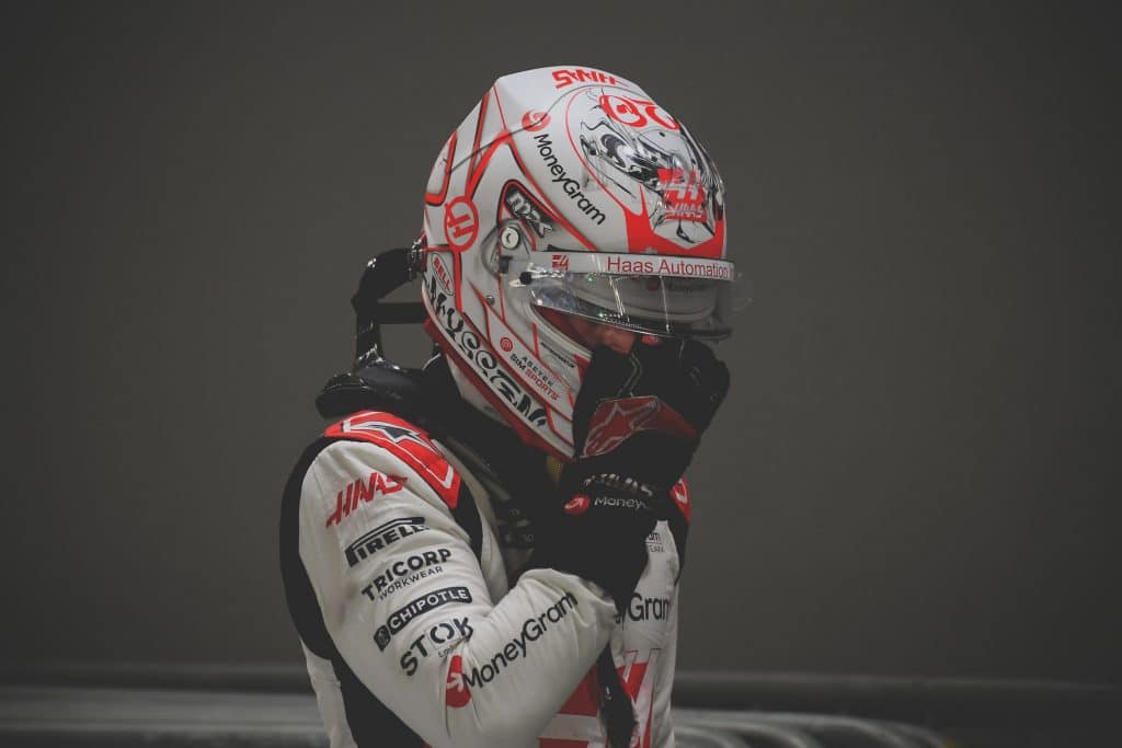 Pit » admin by request Kevin magnussen at the singapore grand prix adjusting his helmet 2023 » admin by request