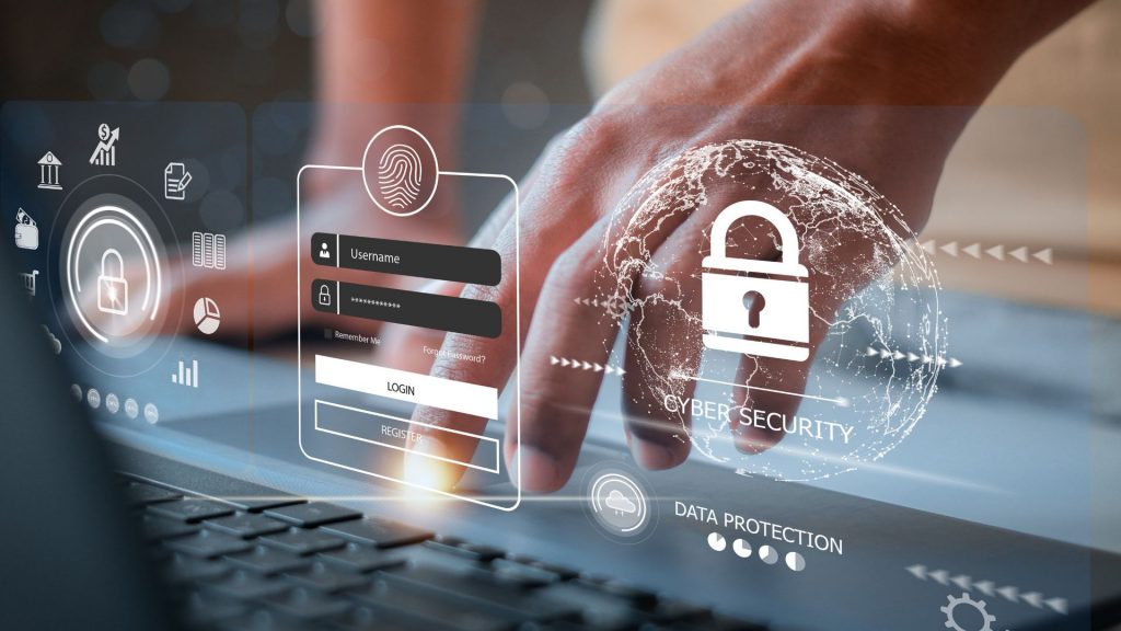 Impact 1 » admin by request A hand typing on a laptop with endpoint privilege management features hovering